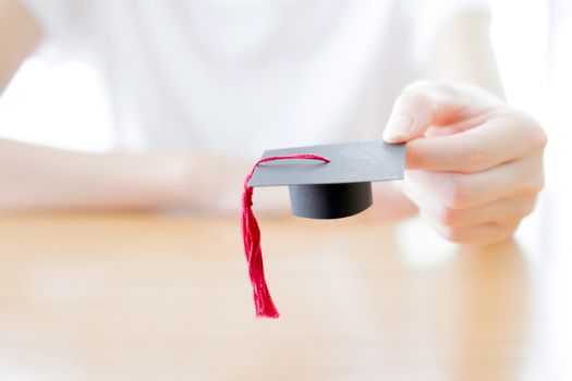  woman holding graduation cap