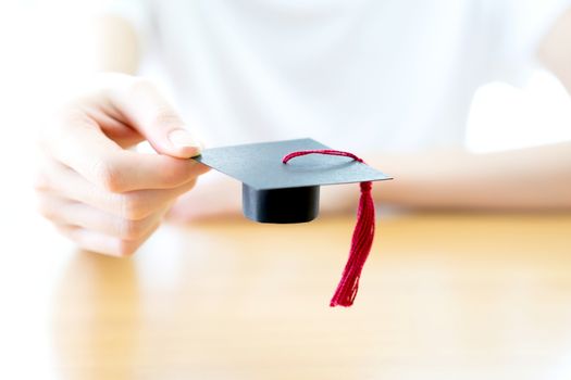  woman holding graduation cap