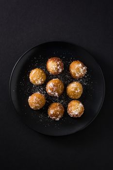 Carnival fritters or buñuelos de viento for holy week on black background