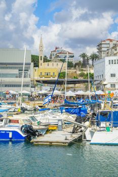 TEL-AVIV, ISRAEL - MAY 27, 2016: View of the Jaffa port and of the old city of Jaffa, with locals and visitors, now part of Tel-Aviv Yafo, Israel