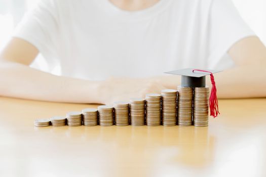 Woman saving education coins