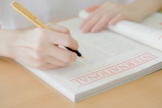 Woman writing on paper