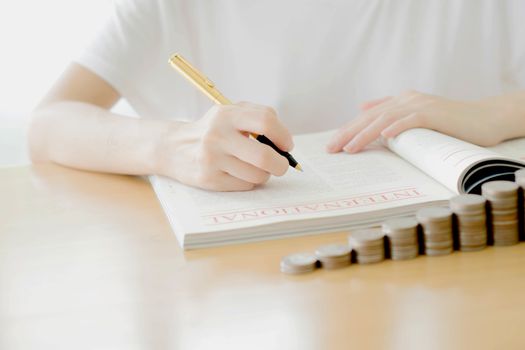 Woman writing on paper