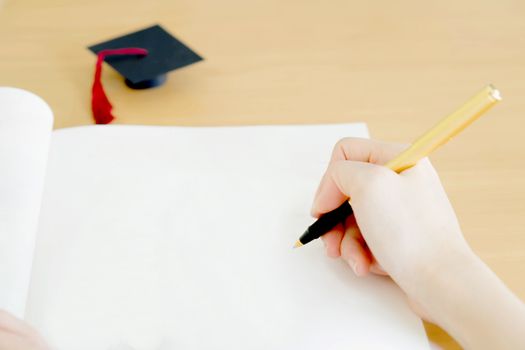 Woman writing on paper