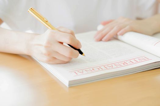 Woman writing on paper