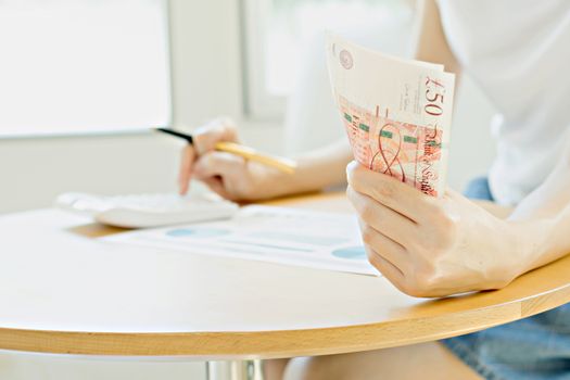 Businesswoman using calculator 