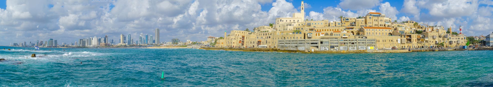 TEL-AVIV, ISRAEL - MAY 27, 2016: Panoramic view of the Jaffa port, the old city of Jaffa, and Tel-Aviv coastal skyline, with locals and visitors, now part of Tel-Aviv Yafo, Israel