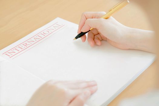 Woman writing on paper