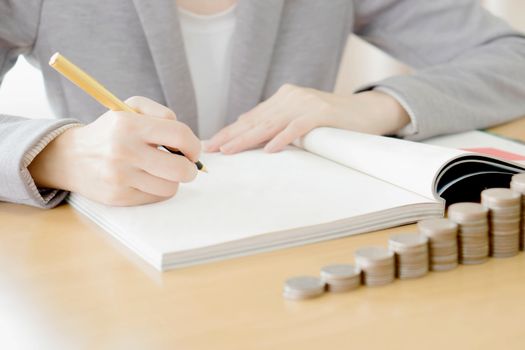 Woman writing on paper