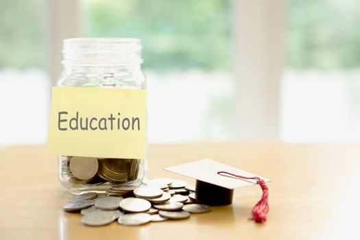 Education budget concept. education money savings in a glass