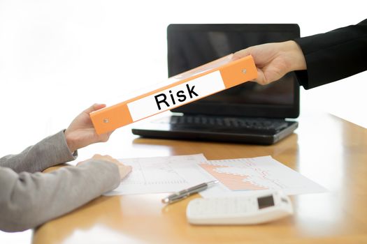 Businesswoman sends the debtor document to the businessman. selective focus.