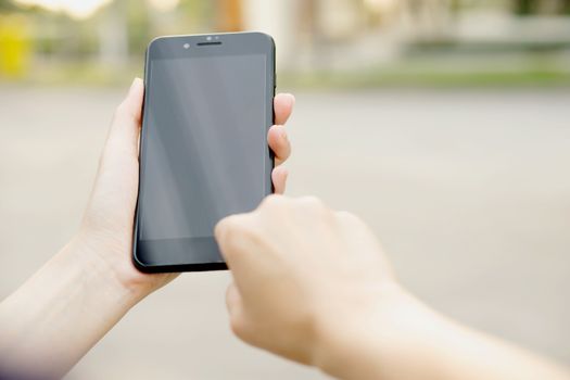 Woman using her Mobile Phone