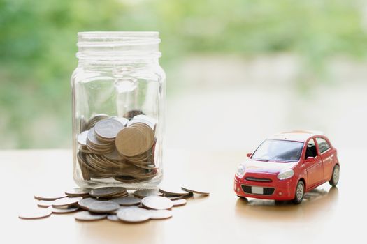 Money saving for Car installment in the glass bottle