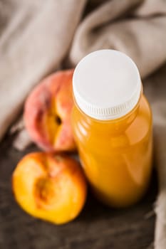 Peach juice in glass isolated on white background