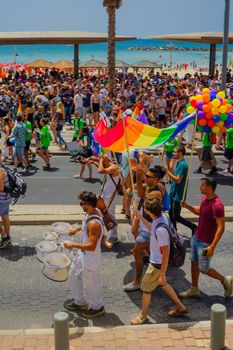 TEL-AVIV, ISRAEL - JUNE 03, 2016: A crowd of people march in the Pride Parade in the streets of Tel-Aviv, Israel. Its part of an annual event of the LGBT community