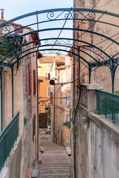 Walking down in a little narrow stairs street in the town of Brignoles in Provence, south of France