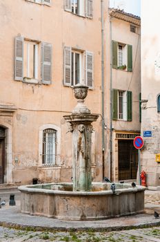 Brignoles, France - October 09, 2009: The old fountain of the Jean Raynaud Square in the town of Brignoles in Provence, south of France