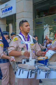 Haifa, Israel - April 27, 2019: Scouts take part in a Holy Saturday parade, part of Orthodox Easter celebration in Haifa, Israel