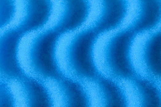 Macro of blue synthetic sponge texture, soft side