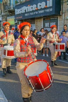 Haifa, Israel - April 27, 2019: Scouts take part in a Holy Saturday parade, part of Orthodox Easter celebration in Haifa, Israel