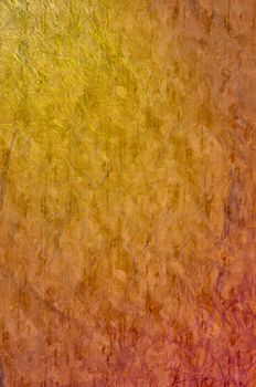 A colored crumpled orange paper texture for background use