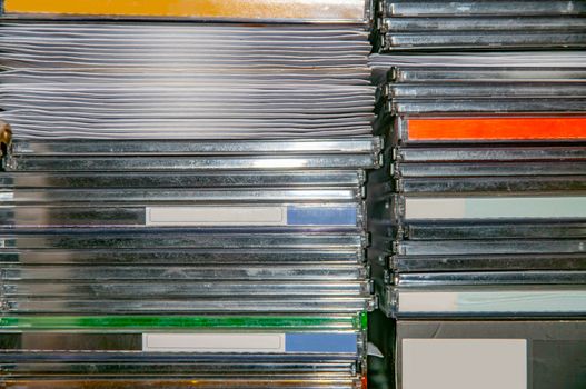 Background made of various CD and DVD cases and sleeves