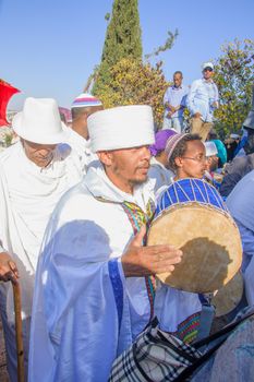 JERUSALEM - NOV 20, 2014: A Kes, religious leader of the Ethiopian Jews, plays a drum to mark the end of the Sigd prays, in Jerusalem, Israel. The Sigd is an annual holiday of the Ethiopian Jews