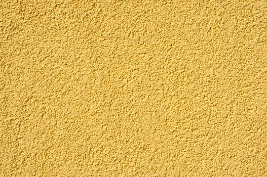 A yellow cement - stucco modern wall texture