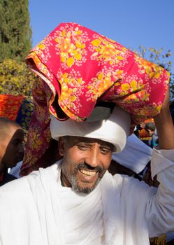 JERUSALEM - NOV 20, 2014: A Kes, religious leader of the Ethiopian Jews, carrying a wrapped holy prayer book, at the end of the annual Sigd holiday prays, in Jerusalem, Israel