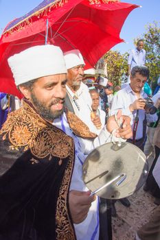 JERUSALEM - NOV 20, 2014: A Kes, religious leader of the Ethiopian Jews, plays a drum to mark the end of the Sigd prays, in Jerusalem, Israel. The Sigd is an annual holiday of the Ethiopian Jews