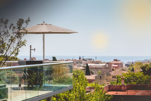 BARCELONA, SPAIN - June 20, 2017 :  terreasse with a beer distributor on the heights of the city with a sea view on a summer day