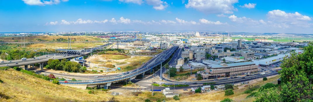 Haifa, Israel - June 13, 2019: Panoramic view of the Check Post junction, and bay area, with transportation centers and various businesses, in Haifa, Israel