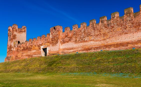 Walled city of Castelfranco Vento, small medieval city in Northern Italy, red brick wall with watchtower