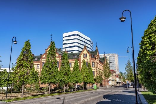 Umea, Sweden - JUNE 10, 2020: Stora Hotel, old historical building in central Umea, Radhusparken park and Kungsgatan street, Vasterbotten, Northern Sweden