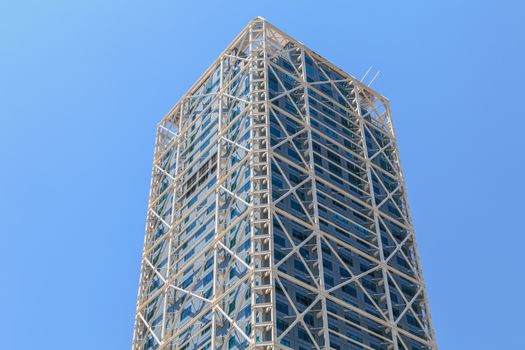 BARCELONA, SPAIN - June 21, 2017 : architectural detail of the Hotel Arts tower during the summer, a skyscraper designed by the American architect Bruce Graham and built for the 1992 Summer Olympics