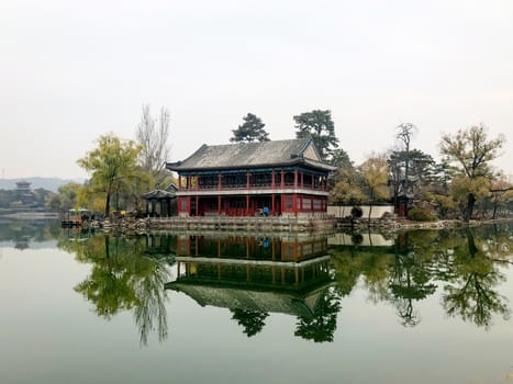 Little pavilions next the lake inside the Imperial Summer Palace of The Mountain Resort in Chengde. China. Chinese ancient building with lake. UNESCO World Heritage.