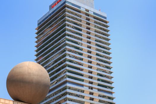 BARCELONA, SPAIN - June 21, 2017 : architectural detail of the MAPFRE tower during the summer, a skyscraper designed by the architects Inigo and Enrique de Leon and built for the 1992 Summer Olympics