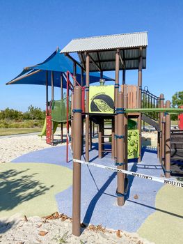 Closed community park with playground for kids due to Covid 19. Coronavirus virus panic and quarantine in San Diego, California, USA.