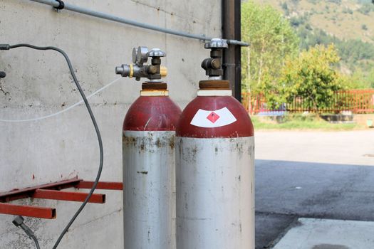 Gas cylinder for welder placed at the construction site.