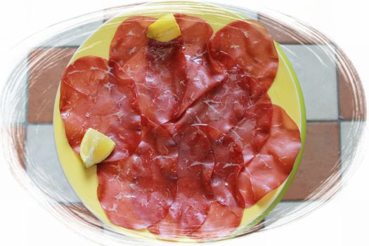 Sliced cured bresaola. Bresaola - Italian beef jerky. Sliced beef bresaol. Italian appetizer, which in the classic version is lean beef salted in a dry way. basturma.Bresaola is a delicious appetizer