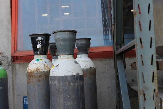 Gas cylinder for welder placed at the construction site.