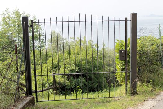 ancient stone gate on the lake in Italy