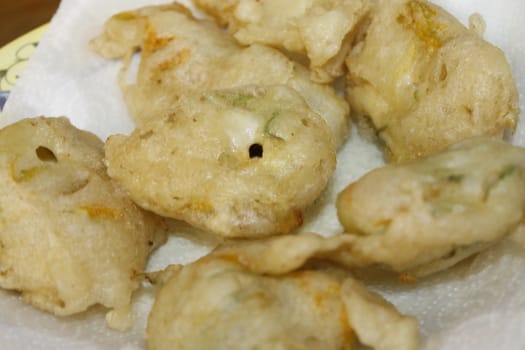 zucchini flowers in batter with mozzarella and anchovies