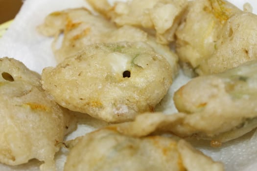 zucchini flowers in batter with mozzarella and anchovies