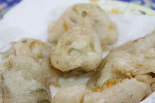 zucchini flowers in batter with mozzarella and anchovies