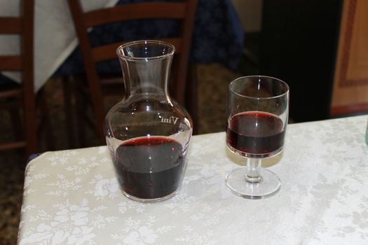 jug and glass of red wine