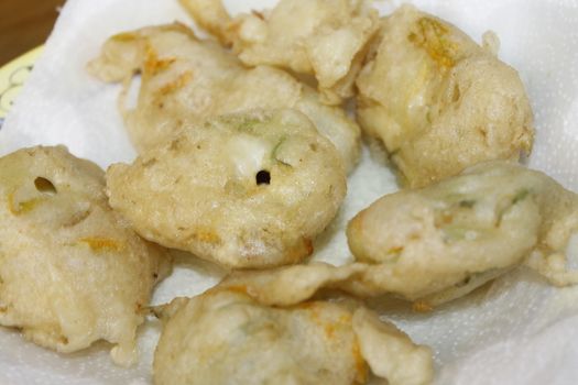 zucchini flowers in batter with mozzarella and anchovies