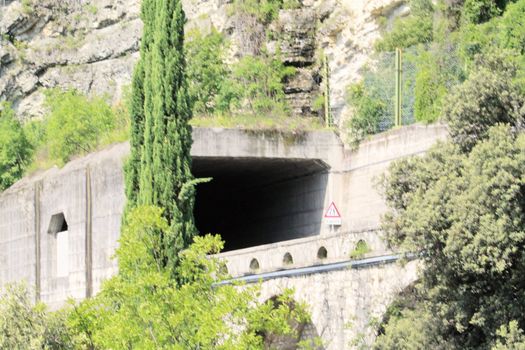 Scenic panoramic beltway road around lake Garda full of tunnels and galleries made in the rocks at the edge of a coastline