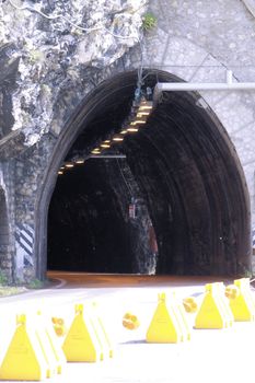 Scenic panoramic beltway road around lake Garda full of tunnels and galleries made in the rocks at the edge of a coastline