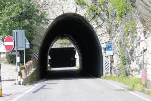 Scenic panoramic beltway road around lake Garda full of tunnels and galleries made in the rocks at the edge of a coastline